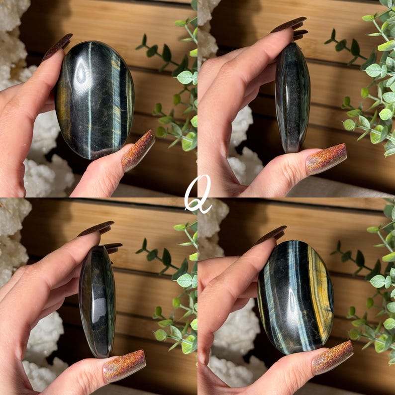 May include: Four views of a polished oval tiger's eye stone. The stone features bands of blue, gold, and black. The stone is held in a hand against a background of greenery and a wooden surface.