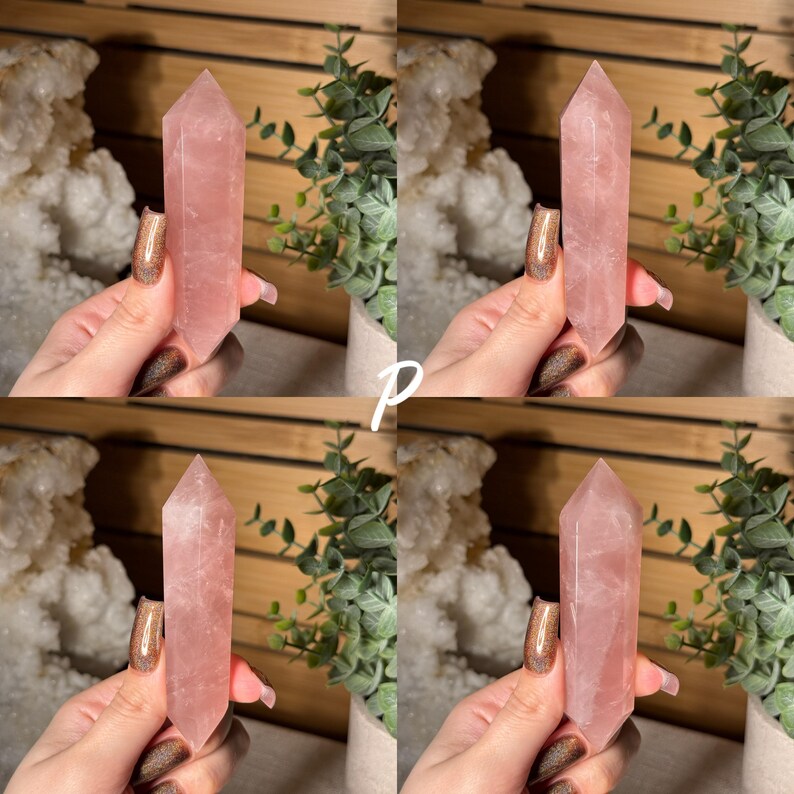 May include: Four rose quartz crystal points, each held in a hand. The crystals are a soft pink color and have a pointed top. Green plants and a white, textured background are visible.