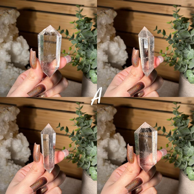 May include: Four images of a clear quartz crystal point. The crystal is held in a hand with long, polished nails. The crystal is transparent with visible internal structures. The letter "A" is visible in white text.