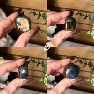 May include: Four polished labradorite stones in various shapes and colors are displayed. The stones range from iridescent blues and golds to darker grays and greens. The letter "B" is visible in white script.