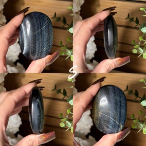 May include: Four images of polished blue tiger's eye stones. Each stone is oval-shaped and held in a hand. The stones have a dark blue base color with streaks of lighter blue and gold. The stones are smooth and reflective.