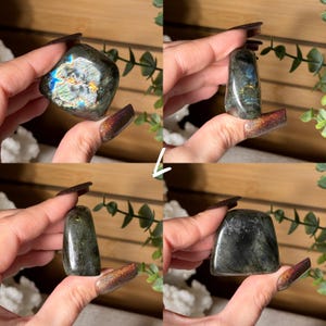 May include: Four views of a polished labradorite crystal. The stone displays a mix of dark gray and green hues with iridescent flashes of blue, gold, and green. The crystal is held in a hand, showcasing its shape and color variations.