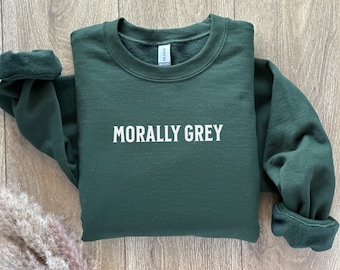 May include: A dark green sweatshirt with the text "MORALLY GREY" printed in white on the front.