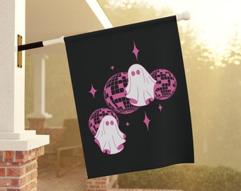 May include: A black flag with two pink ghosts dancing in front of disco balls. The ghosts have pink eyes and are outlined in pink. The disco balls are silver with pink accents.