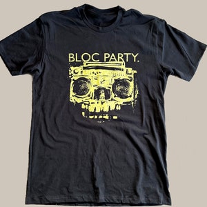 May include: Black t-shirt with a yellow graphic of a boombox and the text "Bloc Party."