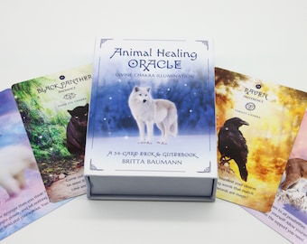 May include: A white box with the text "Animal Healing Oracle" and "Divine Chakra Illumination" on the front. The box contains a 54-card deck and guidebook. The cards feature animal illustrations and chakra themes.