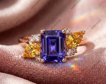 Anillo vintage de tanzanita y zafiro amarillo de plata de ley 925. Anillo con tanzanita talla esmeralda y zafiro amarillo talla pera.