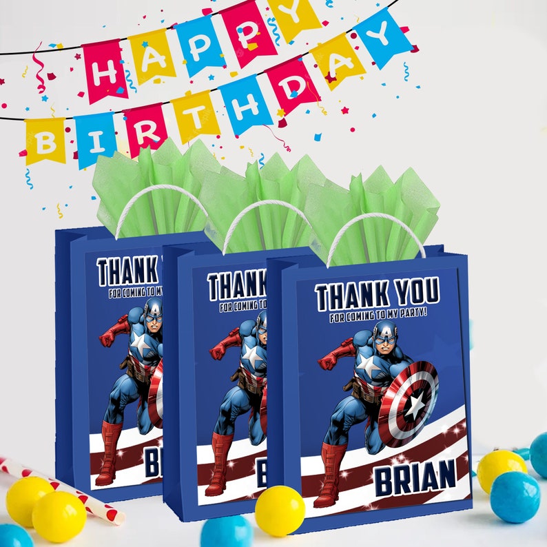 May include: Three blue gift bags with handles, featuring a cartoon image of Captain America. The bags have the text "Thank you for coming to my party!" and the name "Brian".