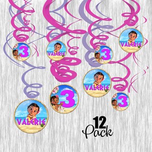 May include: A set of 12 pink and purple swirl party decorations featuring a Moana character, the name "Valerie" and the number "3" on each. The set is labelled "12 Pack".