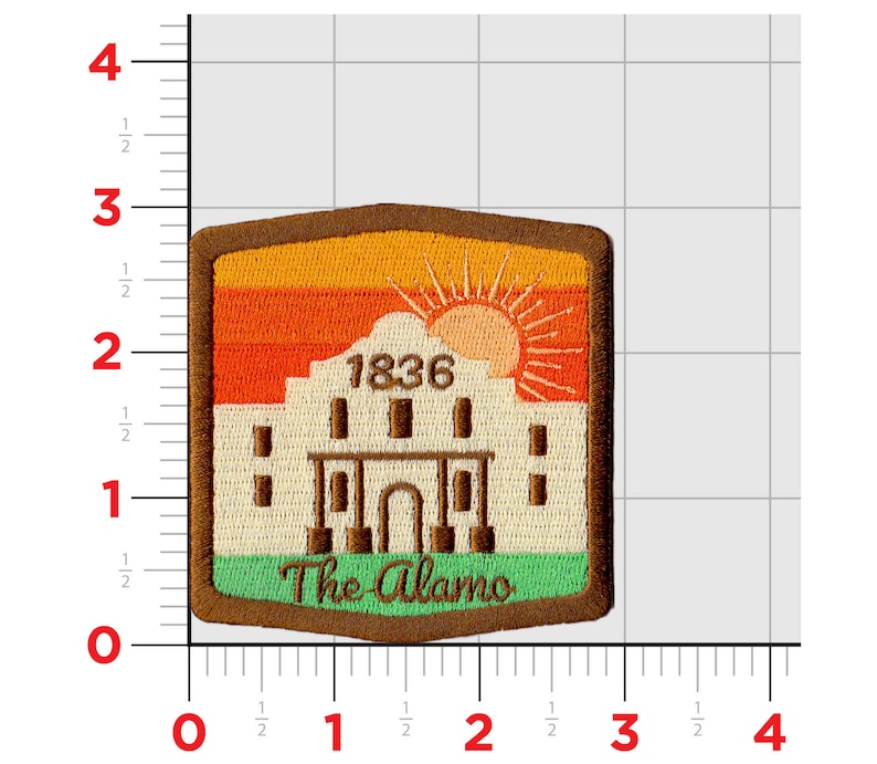 May include: An embroidered patch featuring a beige building with the text "1836" above it. The building is set against a sunset background with orange, yellow, and red stripes. The text "The Alamo" is below the building in green.