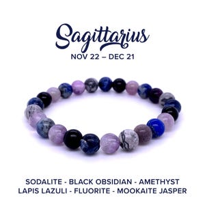 May include: Sagittarius zodiac bracelet with purple, blue, and black beads. The bracelet is made with sodalite, black obsidian, amethyst, lapis lazuli, fluorite, and mookaite jasper.