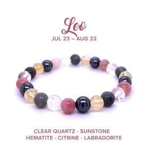 May include: A bracelet made of clear quartz, sunstone, hematite, citrine, and labradorite beads. The bracelet is in a circle and the beads are all different colors. The bracelet is on a white background. The text "Leo" and "JUL 23 - AUG 22" is above the bracelet. The text "CLEAR QUARTZ - SUNSTONE HEMATITE - CITRINE - LABRADORITE" is below the bracelet.