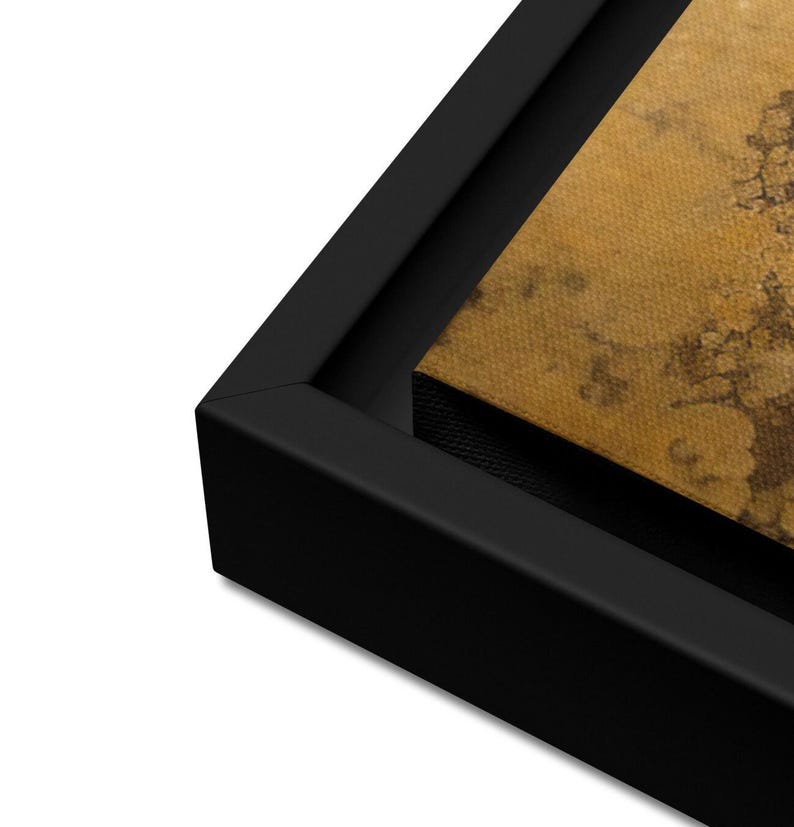 May include: Close-up of a black wood frame surrounding a canvas print with a textured, gold background.