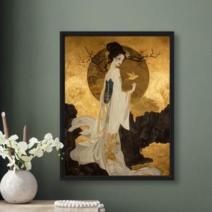 May include: A framed painting of a woman in a white and gold kimono standing in a landscape with a large golden moon. The woman is holding a small white bird in her hand.