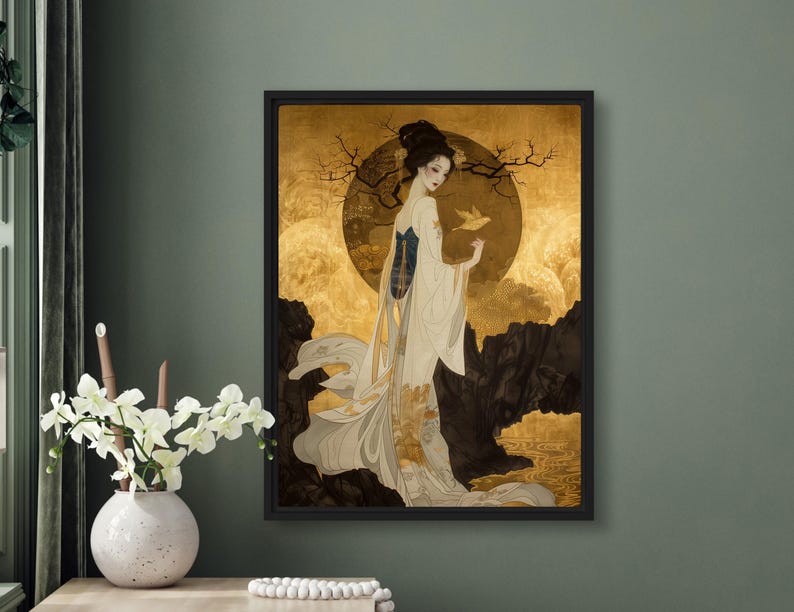 May include: A framed painting of a woman in a white and gold kimono standing in a landscape with a large golden moon. The woman is holding a small white bird in her hand.