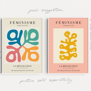 May include: Two minimalist posters with a peach and cream background. The posters feature abstract shapes in yellow, blue, green, and pink. The text on the posters reads "F&Eacute;MINISME" and "LA R&Eacute;VOLUTION".