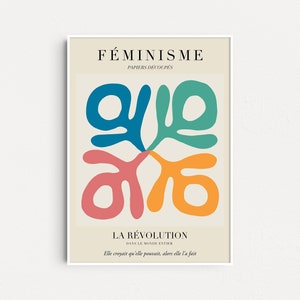May include: A poster with the text "F&Eacute;MINISME PAPIERS D&Eacute;COUP&Eacute;S LA R&Eacute;VOLUTION DANS LE MONDE ENTIER Elle croyait qu'elle pouvait, alors elle l'a fait" in French. The poster features a colorful abstract design with four shapes in blue, green, pink, and orange.