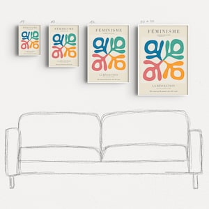 May include: Four different sizes of a poster with a colorful abstract design and the text "FEMINISME LA REVOLUTION" in French. The poster is hanging on a white wall above a sketched outline of a couch.