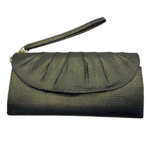 May include: A dark metallic bronze wristlet clutch featuring a textured lizard-skin pattern. The rectangular bag has a curved, pleated flap closure and a matching detachable wrist strap attached with a gold-toned metal clasp on the left side.