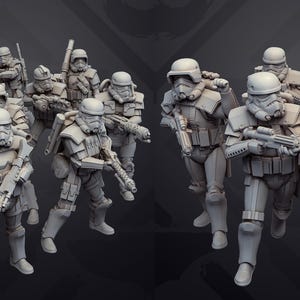 May include: A collection of grey figurines depicting soldiers in futuristic armour, each holding a weapon. The figures are posed in various stances, suggesting movement and action. The overall aesthetic is reminiscent of science fiction or fantasy themes.
