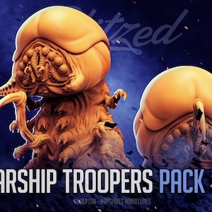 May include: Two 3D printed miniature alien creatures from the Starship Troopers movie franchise. The creatures are a light brown colour and have a detailed, textured surface. The text "Starship Troopers Pack #31" is visible at the bottom of the image.