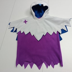 May include: A hooded costume with a white cape and purple body. The cape has a jagged edge and a purple cross on the chest. The hood and cape have blue accents. This costume is suitable for Halloween or cosplay.