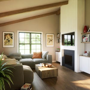 Great room with large windows and fireplace – open to kitchen/dining. Vaulted ceilings for bright, airy interior feel.