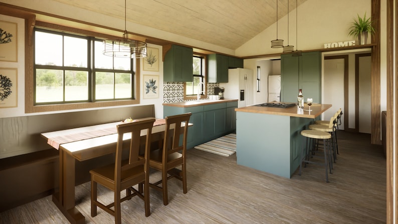 Open kitchen/dining space beneath vaulted ceilings – part of the 24x32 cabin plan.