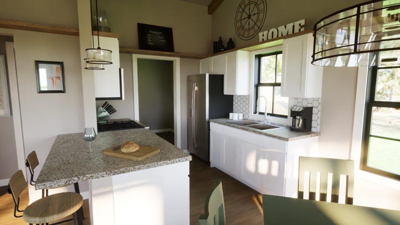 Great room with large windows and fireplace – open to kitchen/dining. Vaulted ceilings for bright, airy interior feel.