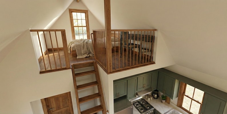 K&ouml;nnte beinhalten: Innenaufnahme eines kleinen, gem&uuml;tlichen Lofts mit Bett, K&uuml;che und Sitzecke. Das Loft verf&uuml;gt &uuml;ber Holzgel&auml;nder, eine Holztreppe und ein kleines Fenster. Die K&uuml;che hat gr&uuml;ne Schr&auml;nke und einen Edelstahlherd.