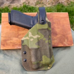 Titan Tactical Gen 5 Glock 17 with Olight PL-3 Valkyrie Holster