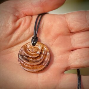 Handmade carved wooden pendant