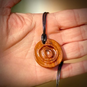 Original carved wood pendant