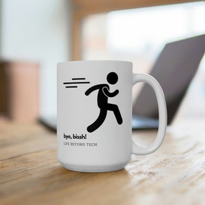 May include: White ceramic mug featuring a black silhouette of a person running away from a laptop. The mug has the text "bye, bissh! LIFE BEYOND TECH" printed on it.