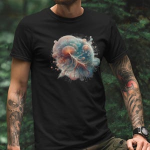 May include: A black t-shirt with a colorful abstract design of a swirling nebula with a tree-like structure in the center.
