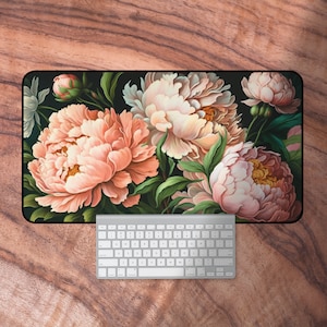 May include: A floral design mouse mat with pink and white peonies on a dark green background.