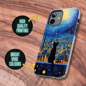 May include: A black cat silhouette sits on a rooftop overlooking a city skyline at night. The city lights are illuminated in yellow and orange, and the sky is a dark blue with a bright yellow moon and white stars. The phone case is made of a hard plastic material and has a glossy finish.