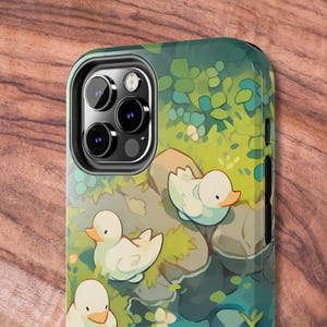 May include: A phone case with a green and blue nature scene featuring three white ducks. The case has a black camera cutout with three lenses.
