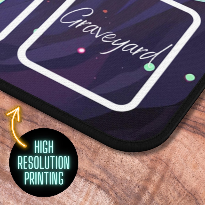 May include: A black mousepad with a white border and the word "Graveyard" in white text. The mousepad has a dark purple background with white and green accents.