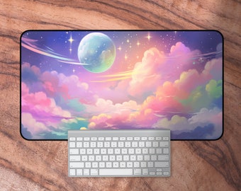 May include: A colorful galaxy-themed mousepad with a large, light blue planet and pink, purple, and yellow clouds. The mousepad has a black border.