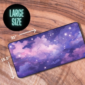 May include: A large purple and pink galaxy-themed mouse mat with white stars. The mouse mat measures 78.7 cm by 39.4 cm.