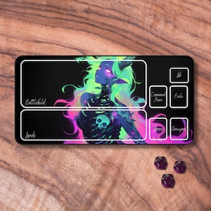 May include: A black and white playmat with a colorful illustration of a woman with green and purple hair. The playmat has sections labeled "Battlefield", "Lands", "Command Zone", "Library", "Graveyard", "Exile", and "Life".