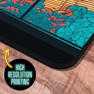May include: A black mousepad with a colorful image of a stained glass window with a floral design. The mousepad has a stitched edge and the text "HIGH RESOLUTION PRINTING" is printed on the bottom right corner.