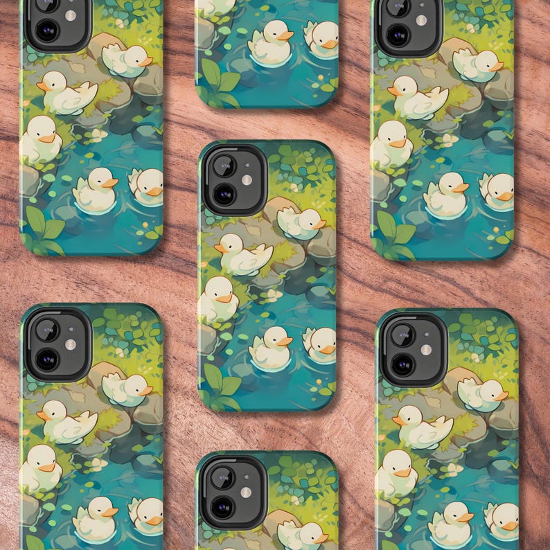 May include: A set of 10 phone cases featuring a whimsical design of white ducks swimming in a blue pond with green foliage. The cases are designed for a variety of phone models.