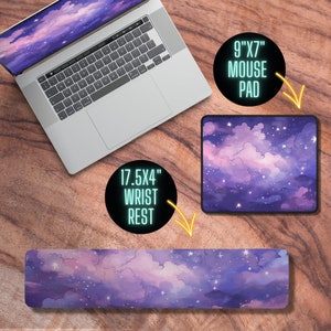 May include: A set of three mouse mats and a wrist rest featuring a purple and pink starry sky design. The mouse mats are 9 inches by 7 inches and the wrist rest is 17.5 inches by 4 inches.