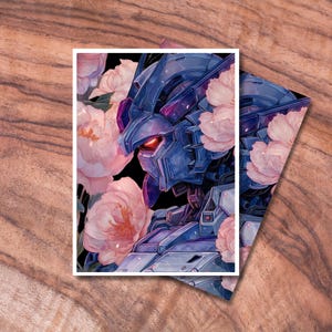 May include: A print featuring a blue robot with red eyes, surrounded by pink and white flowers. The artwork has a digital painting style, with a black background and a white border. The print is on a wooden surface.