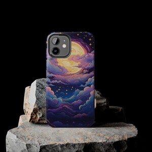 May include: A phone case featuring a colourful illustration of a moon and clouds against a dark blue background. The case has a cutout for the camera lens.