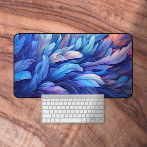 May include: A blue and purple abstract feather design mouse mat. The mouse mat is rectangular and has a black border.