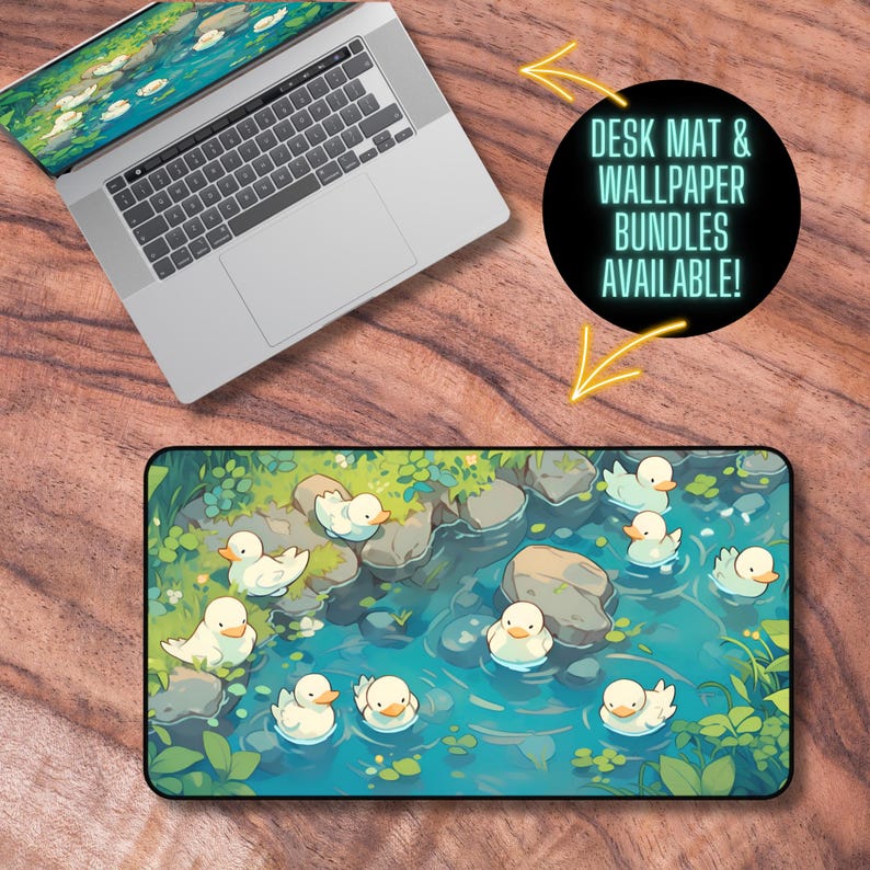 May include: A blue and green illustrated desk mat with white ducks swimming in a stream. The text "DESK MAT & WALLPAPER BUNDLES AVAILABLE!" is in a black circle with a white outline.