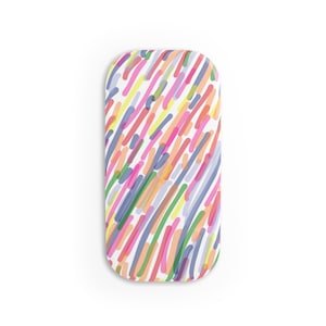 May include: A white oval-shaped phone case with a colorful abstract pattern of diagonal lines in shades of pink, blue, green, yellow, and orange.